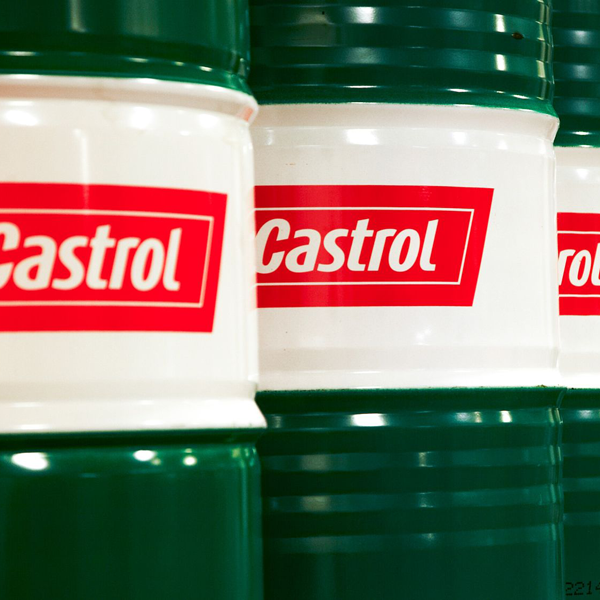 Green barrels of Castrol coolants and lubricants.